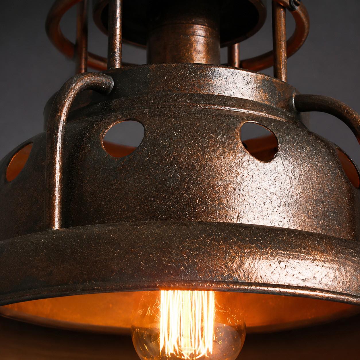 close view of aged iron finish and open bulb area