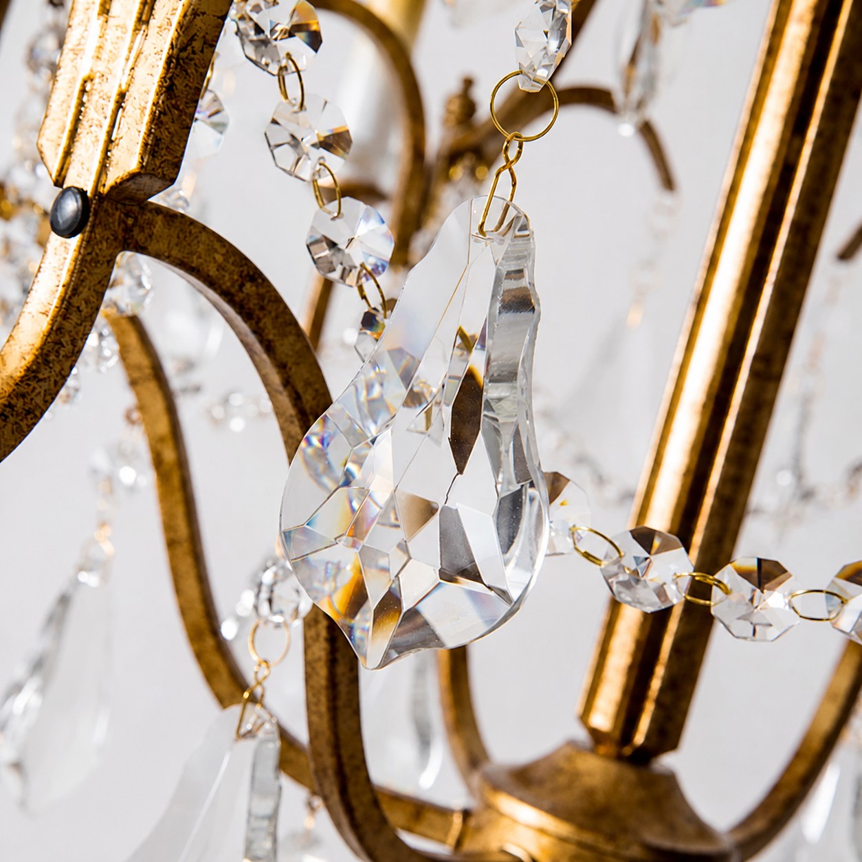 Faceted crystal drops create a luxurious sparkle