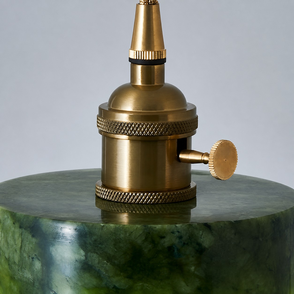 Brass socket fitting above the jade shade