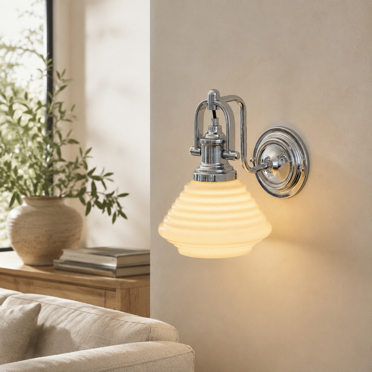 Creamy yellow glass wall sconce in a sunlit lounge