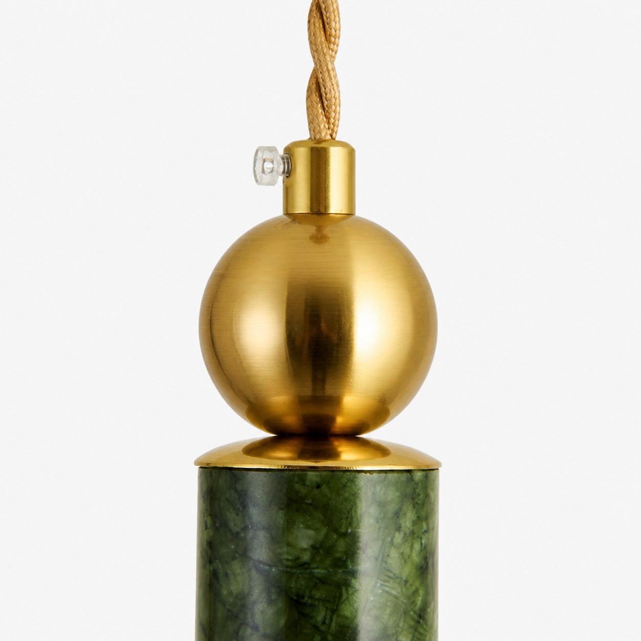 Brass sphere and jade body connection