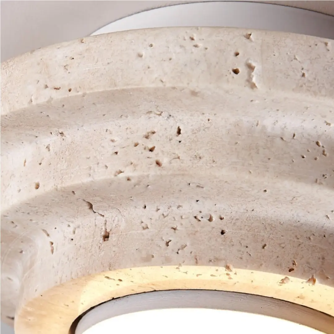 Close-up of the natural beige travertine texture and layered profile