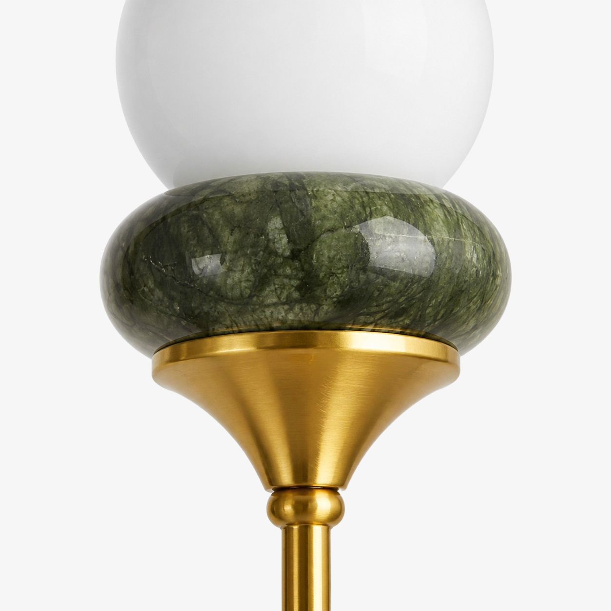 Globe shade seated above its jade collar
