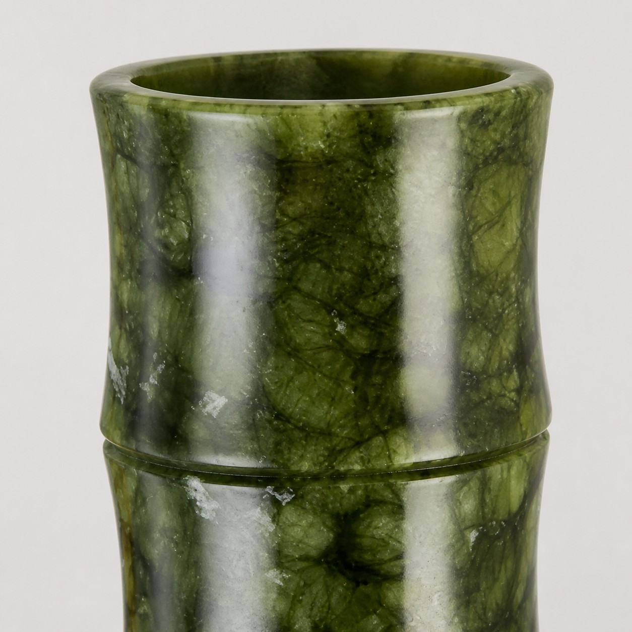 Close view of the cylindrical jade sleeve