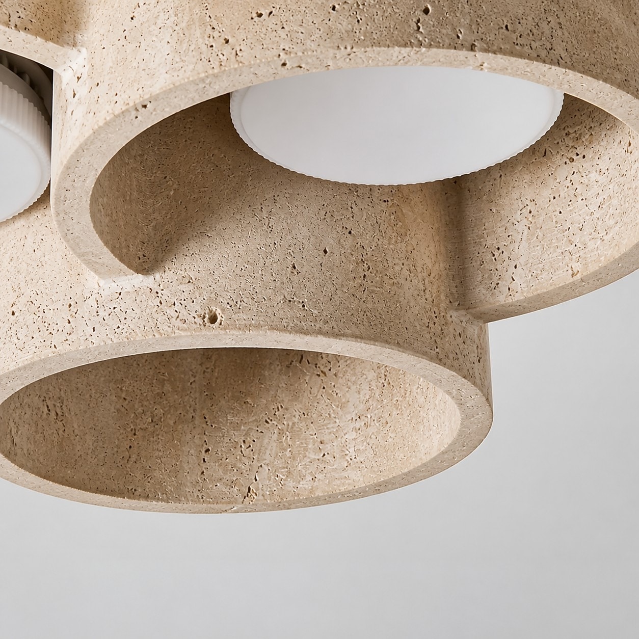 Layered underside detail of travertine ceiling light