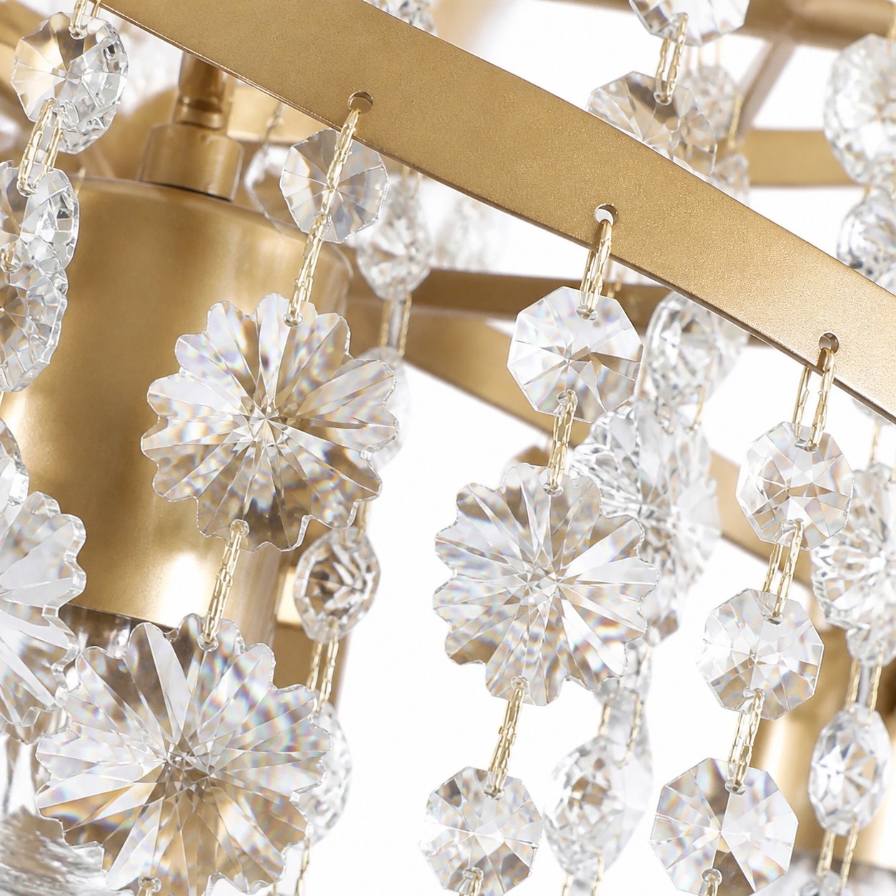 Faceted crystal flowers suspended from a gold-tone frame