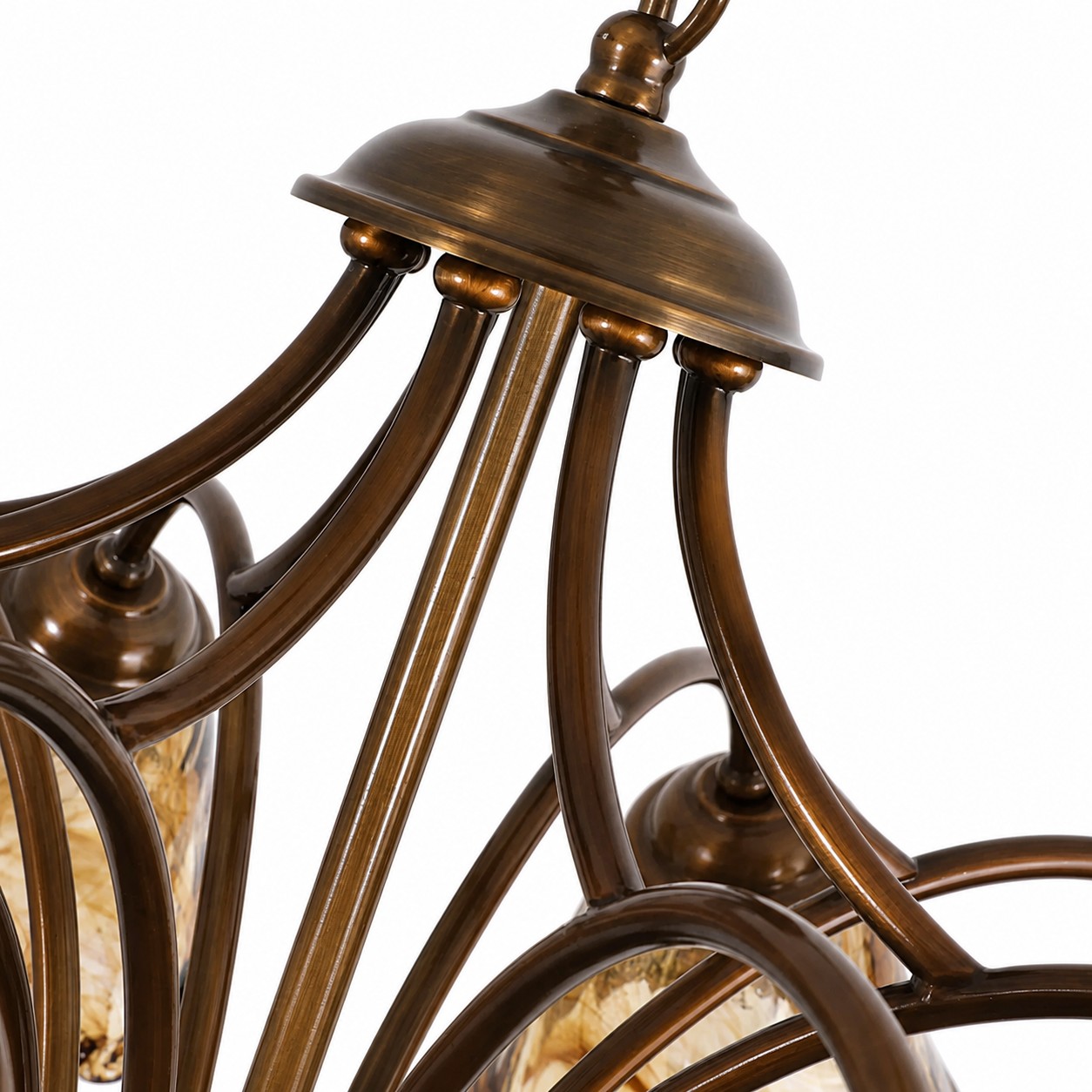Sculpted brass canopy and sweeping chandelier arms