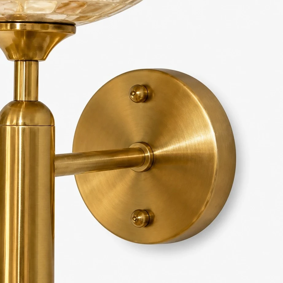 Close view of the brushed brass wall plate