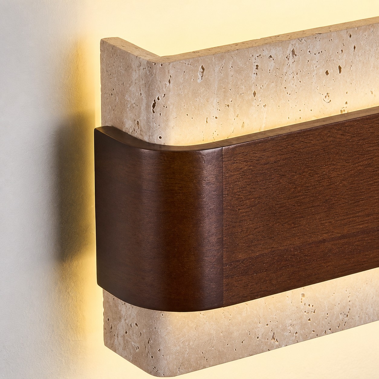 Rounded wood side and glowing travertine edge detail