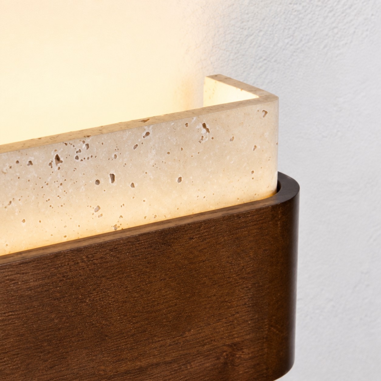 Close view of travertine stone texture and wood band