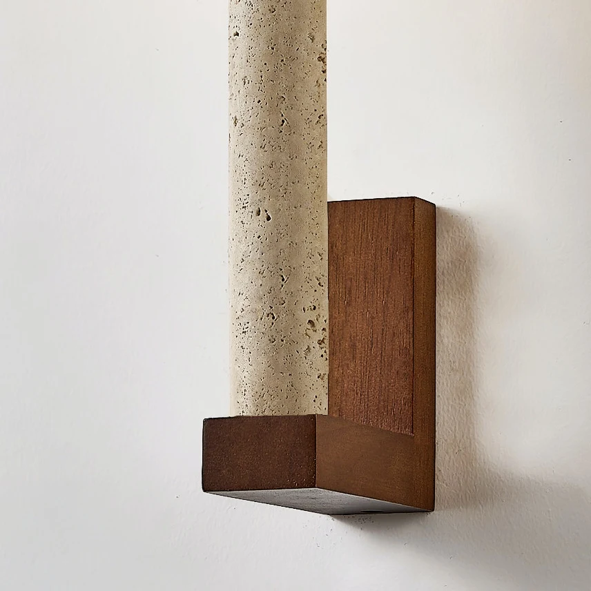 Side view of the natural travertine and solid wood wall sconce