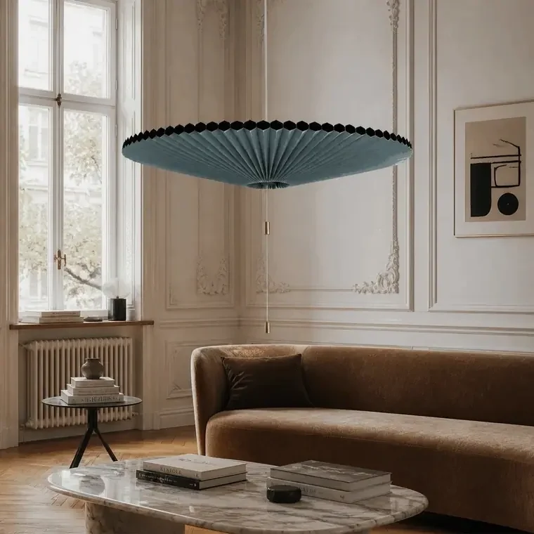 Adjustable pleated pendant light in an Altbau living room with on and off lighting effect