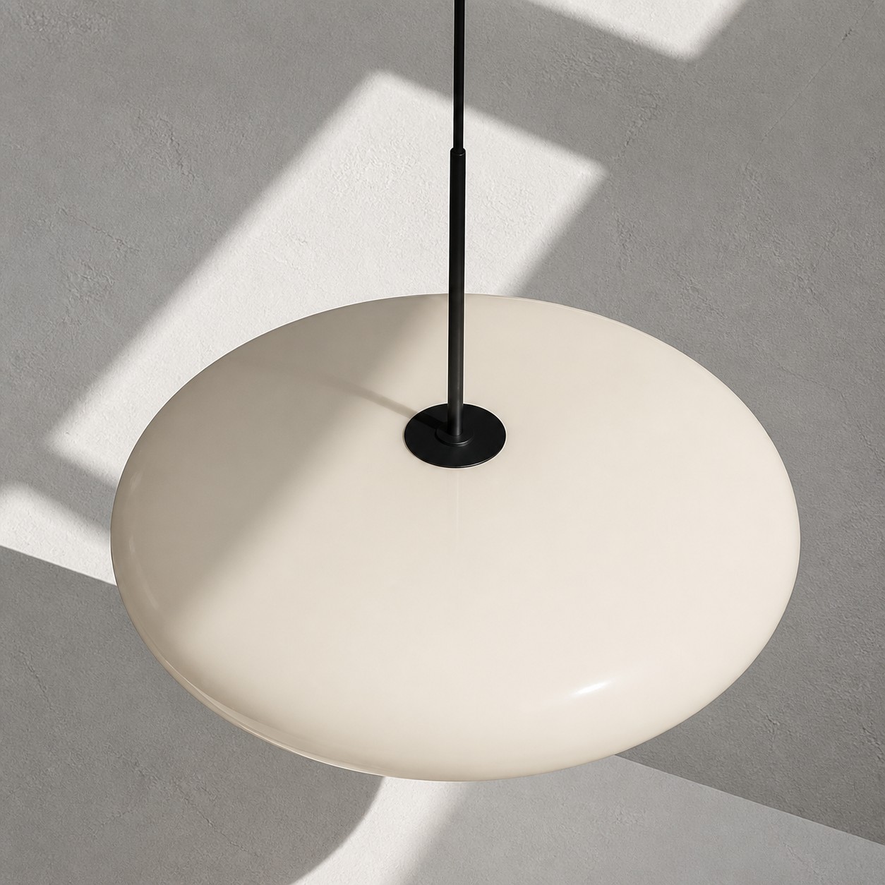 Close-up of the smooth curved white lamp shade