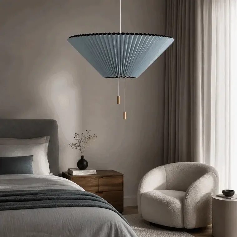 Adjustable pleated pendant light in a bedroom lounge with on and off lighting effect