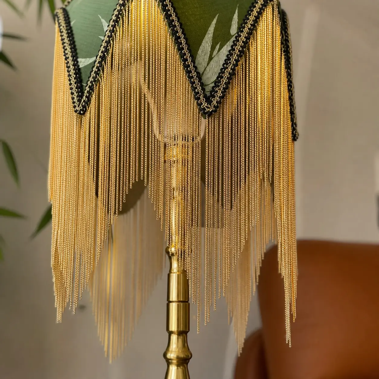 Gold tone tassel and shade trim detail
