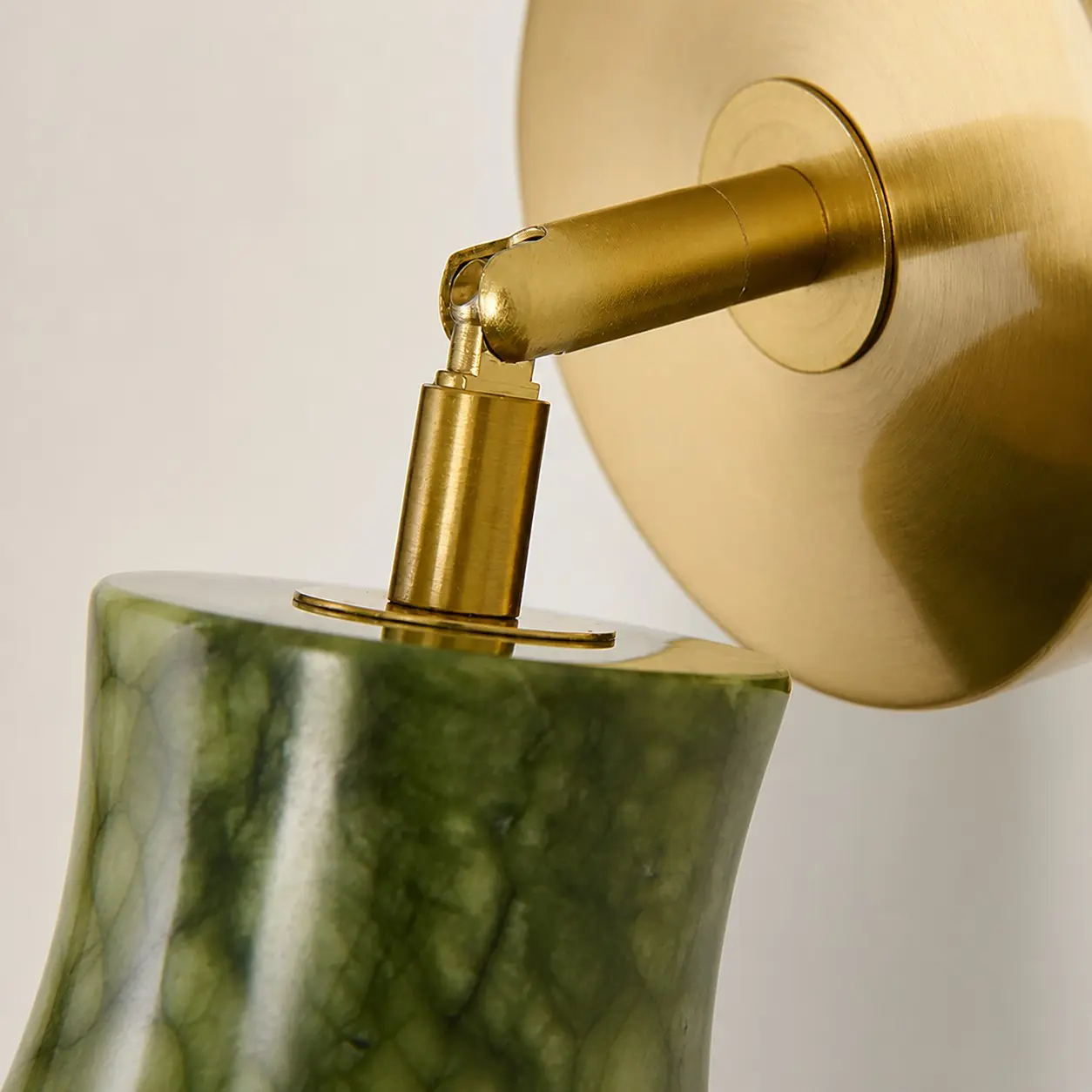 Close view of the adjustable wall sconce joint