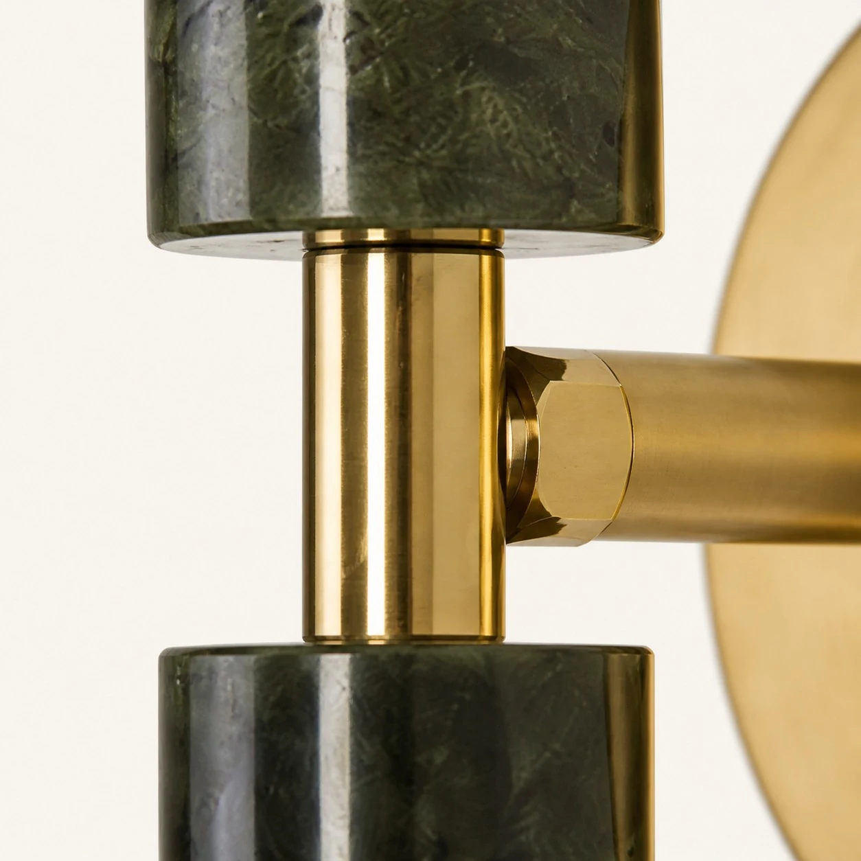 Close view of the central metal connection and stone shade mounting