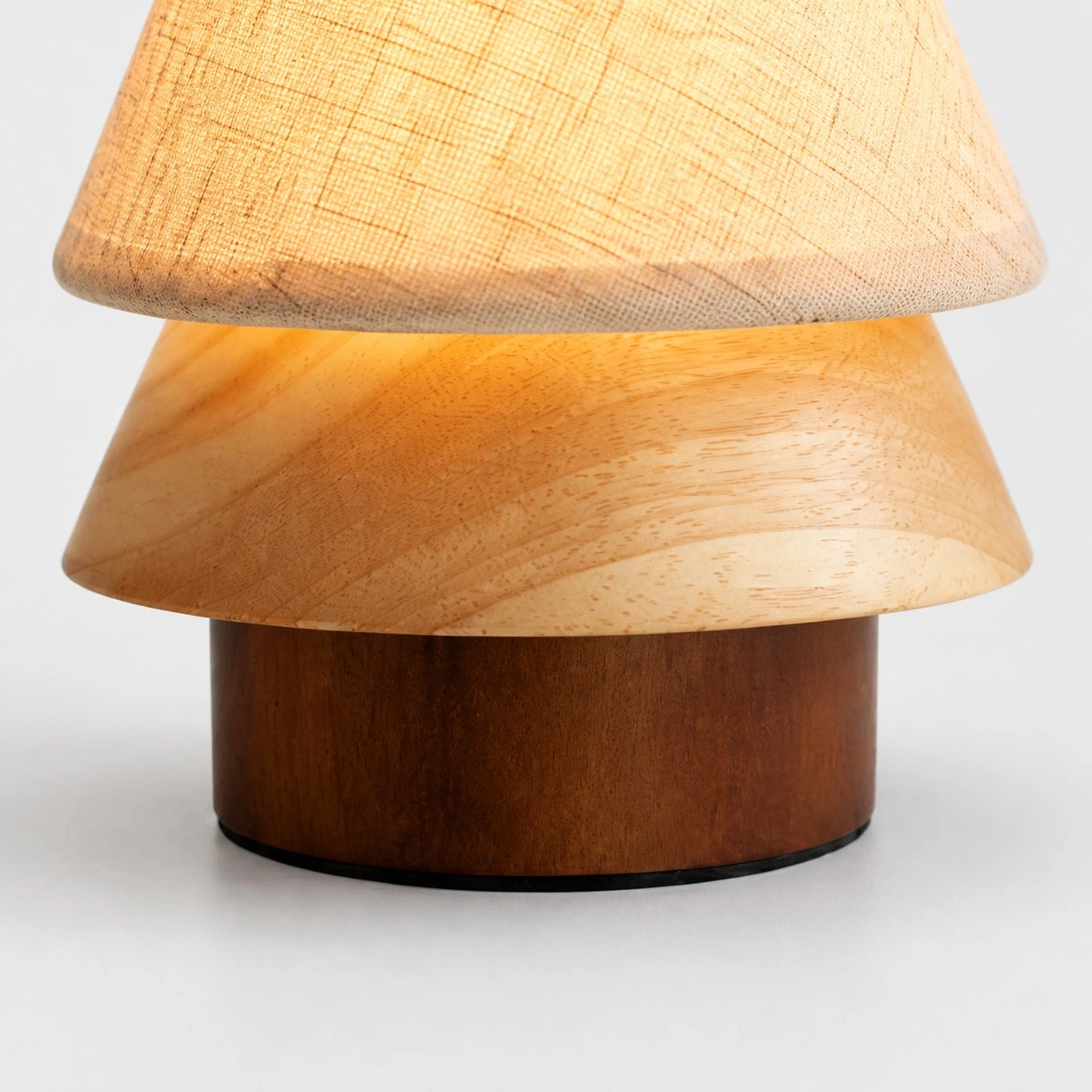 Close view of the wood lamp body and dark base