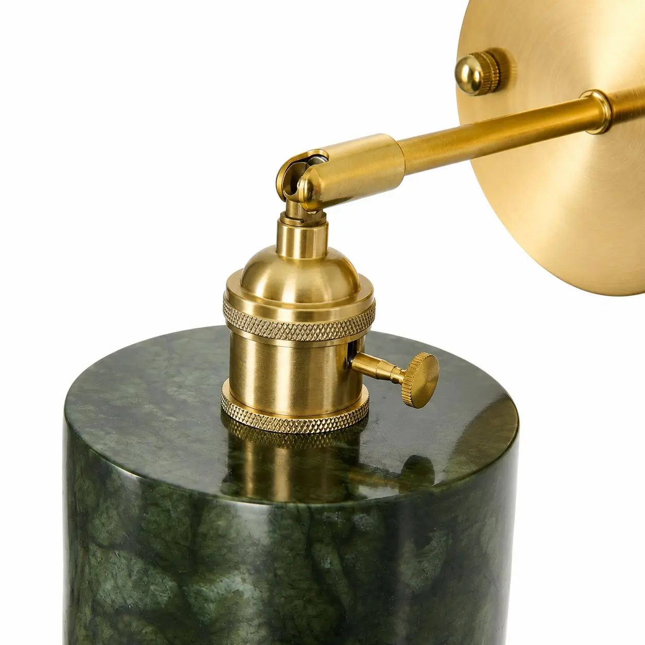 Close-up of brass lamp holder and button control