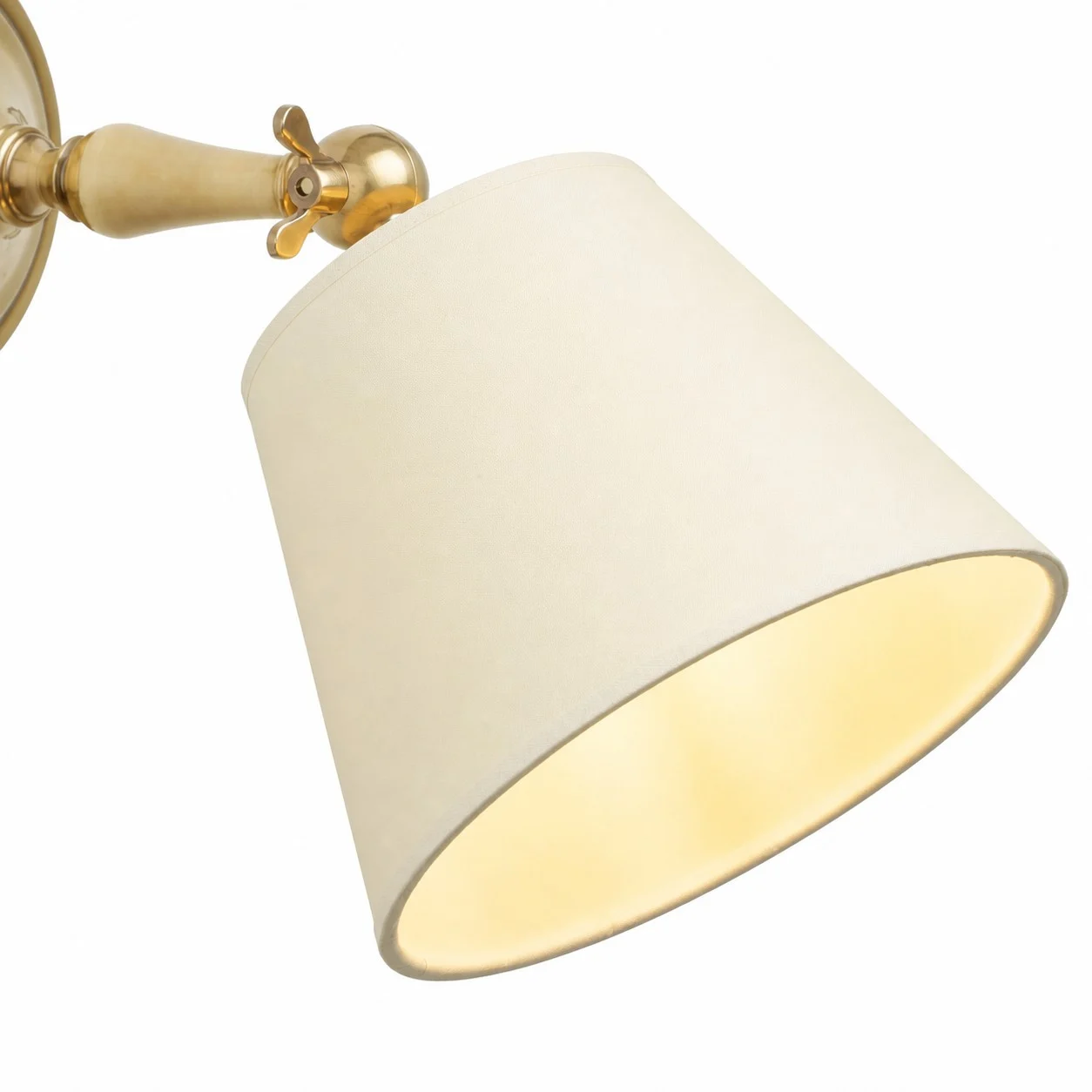Cream fabric shade and brass hinge detail