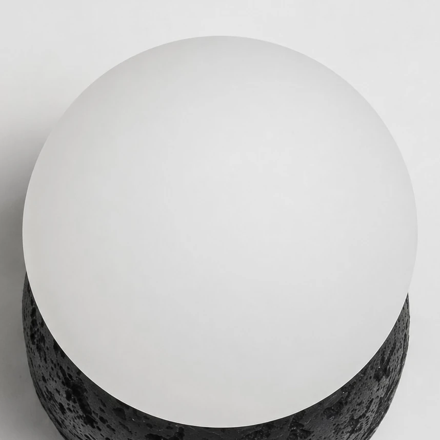 Close view of the opal glass globe and black textured base