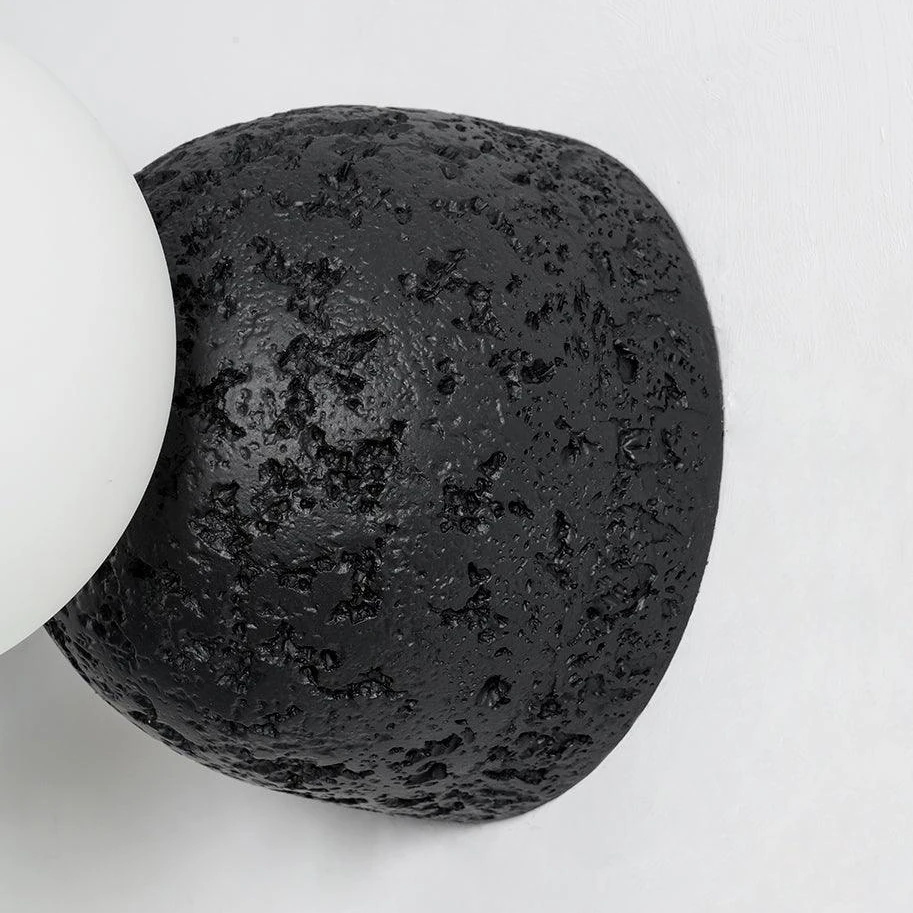 Close view of the tactile black concrete surface