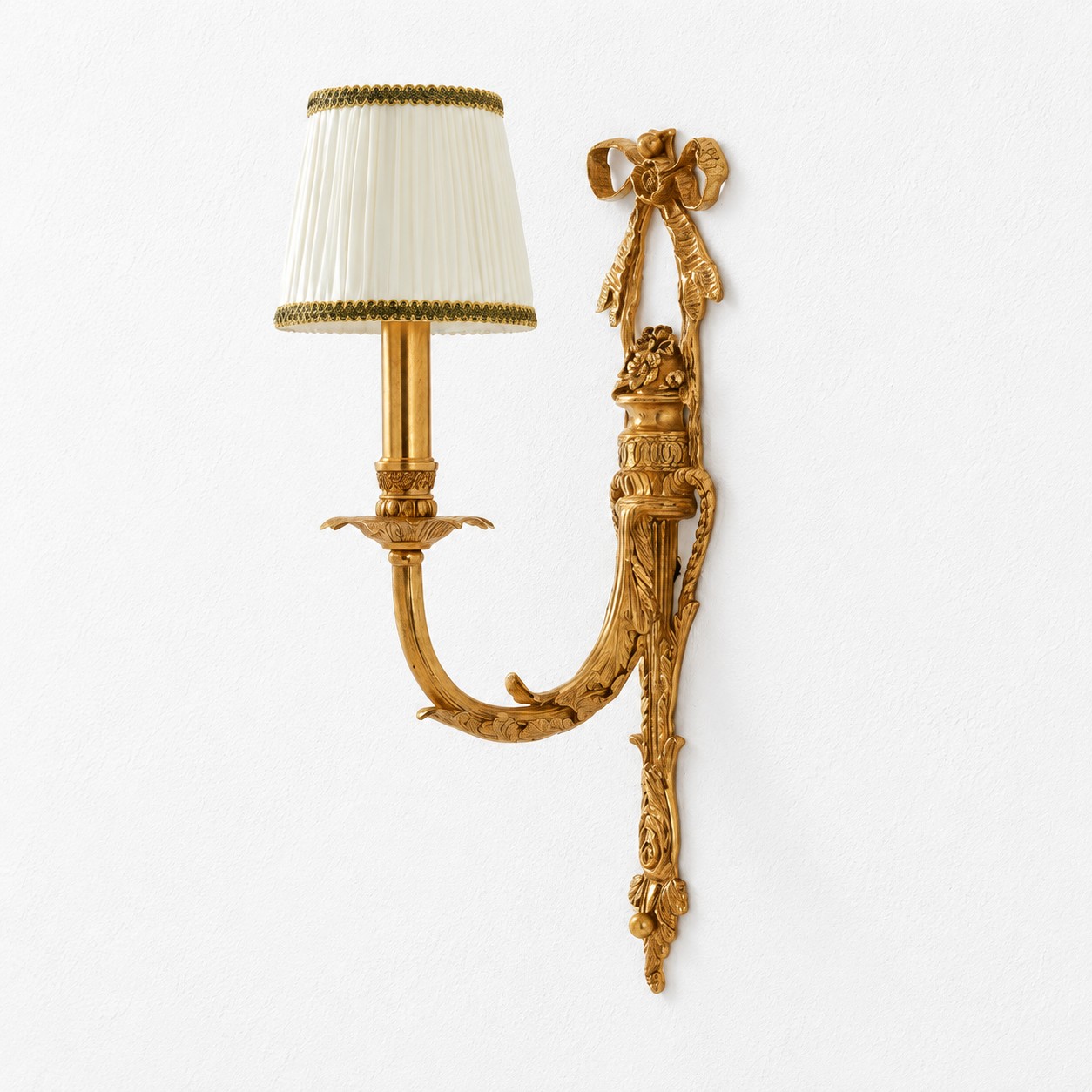 One-head brass wall sconce with white pleated fabric shade