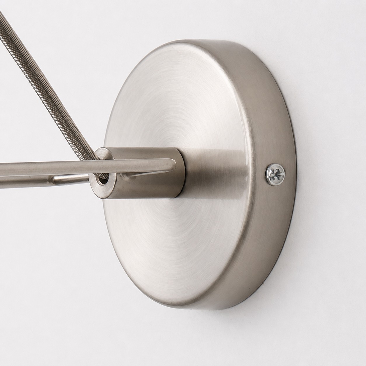 Close view of the round brushed nickel wall plate