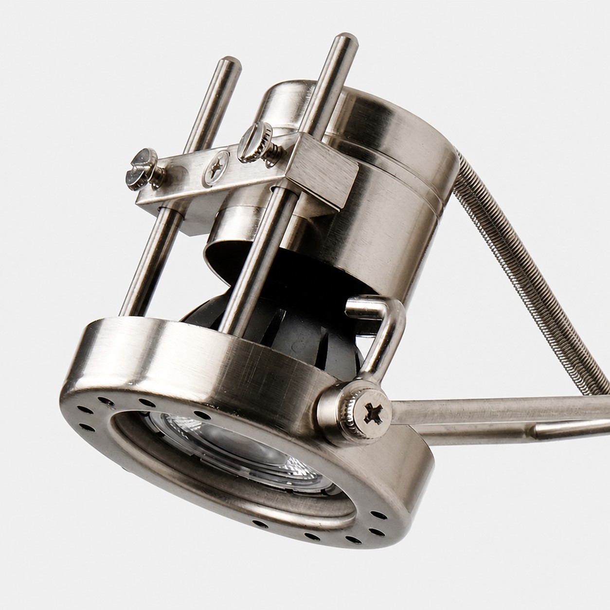 Close view of the adjustable brushed nickel lamp head