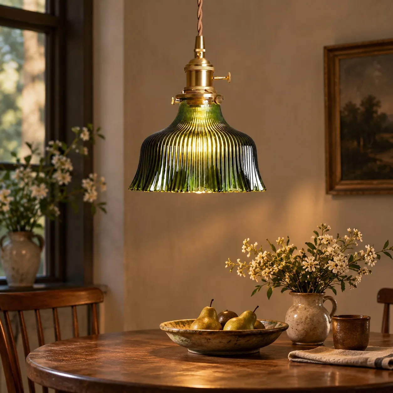 Vintage green floral glass pendant light over a dining table